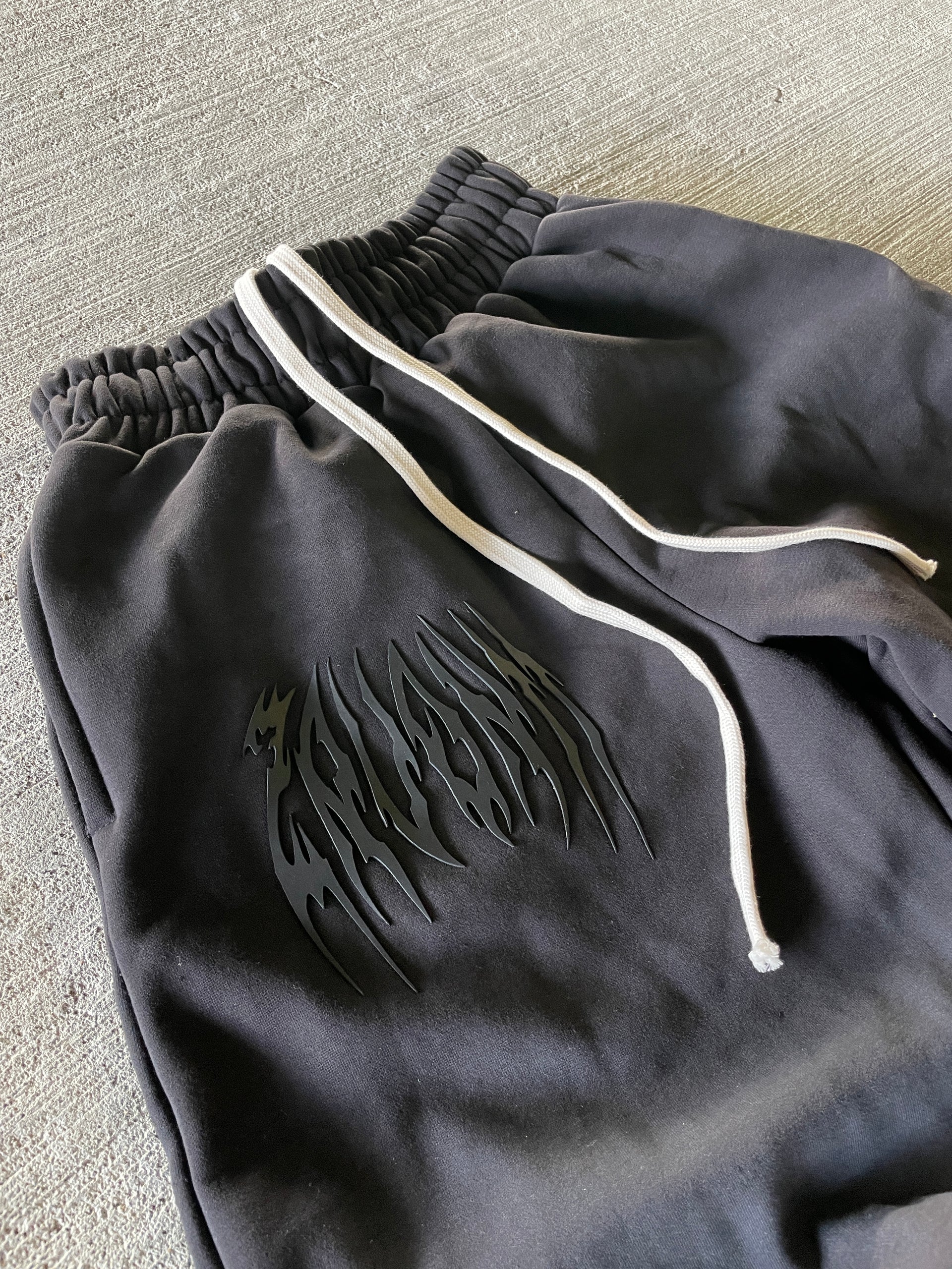 BLACK JAGGED WIDE LEG SWEATS